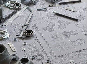 Industrial Engineers create custom metal part drawings for precision CNC Machining.